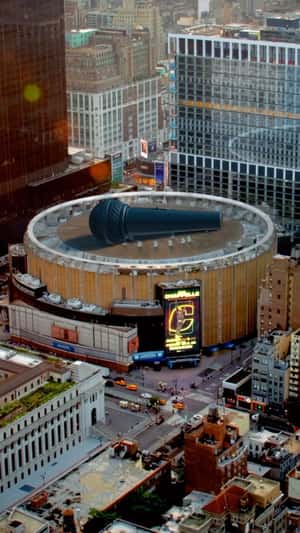 Giant Mic Lands on Roof in a fake-out-of-home ad of Madison Square Garden 