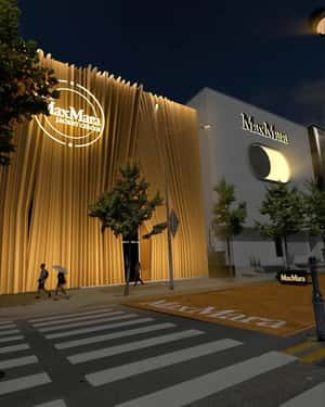 Giant Max Mara Buttons Roll Through Street in a fake-out-of-home ad of Vogue