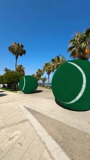 Giant Balls at Molos Promenade in a fake-out-of-home ad of Green Padel Club