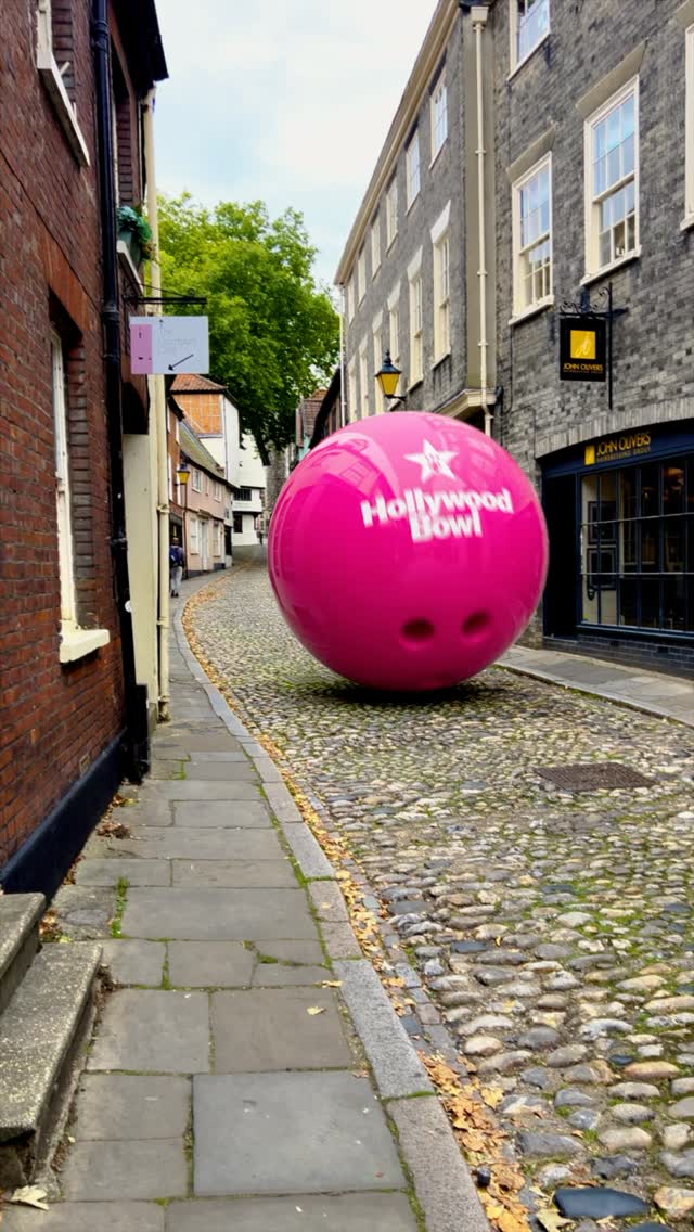 Giant Bowling Ball and Dart in Norwich in a fake-out-of-home ad of Norwich