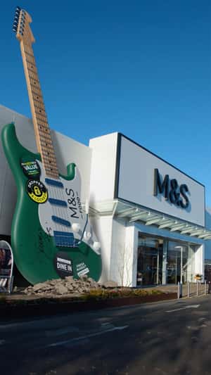 Green Guitar Landing in fake-out-of-home ad of Marks & Spencer
