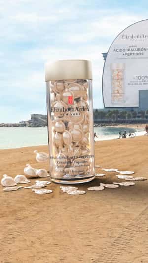 Giant Bottle on La Barceloneta Shore in a fake-out-of-home ad of Elizabeth Arden