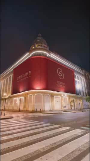 Giant Perfume Emerges from Facade in a fake-out-of-home ad of Oriflame 