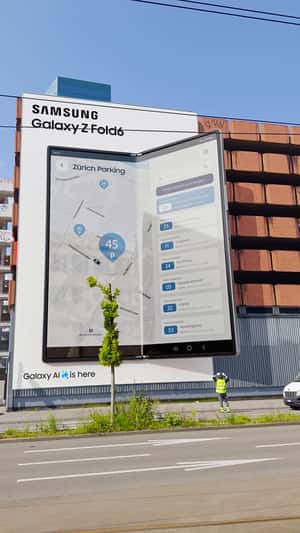 Giant Phone Unfolds from Building Facade in a fake-out-of-home ad of Samsung