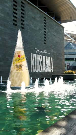 Giant Bottle Fountain at the NGV in a fake-out-of-home ad of Schweppes 