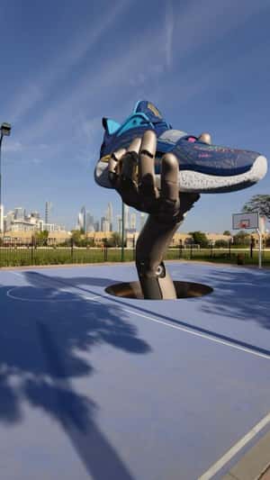 Robotic Hand Presents Giant Shoe in a fake-out-of-home ad of Anta Sports