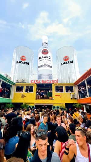 Giant Rum and Glasses Atop Casa Bacardi in a fake-out-of-home ad of Bacardi