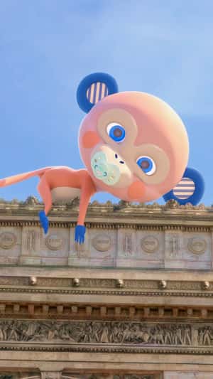 Monkey Mascot Gets Pacifier Atop the Arc de Triomphe in a fake-out-of-home ad of Biolane
