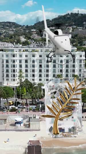 Helicopter Airlifts Giant Palm d'Or in a fake-out-of-home ad of Chopard