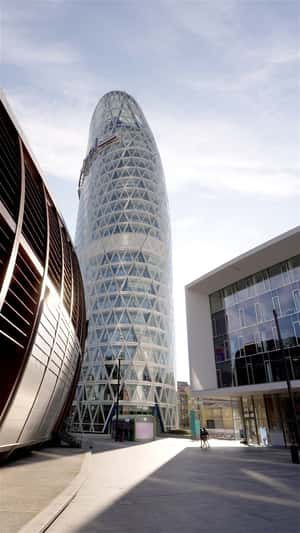 Helicopter Lands Giant Container Near Unipol Tower in a fake-out-of-home ad of Dacia