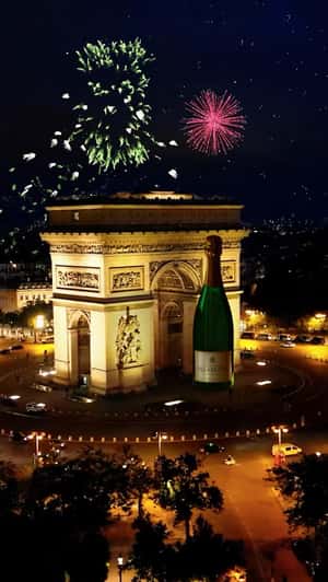 Giant Bottle Arc de Triomphe in a fake-out-of-home ad Champagne Delamotte