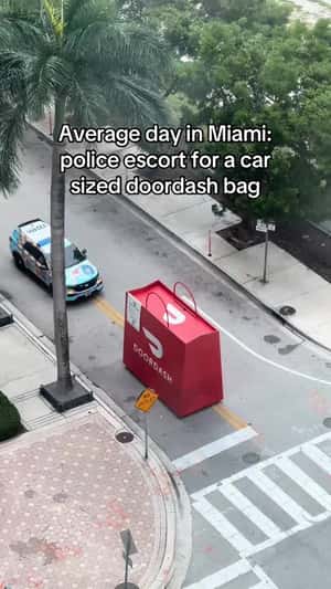 Giant DoorDash Bag on Street in a fake-out-of-home ad of Secret Miami 