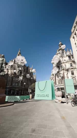 Giant Products Float at Antwerp in a fake-out-of-home ad of Douglas 