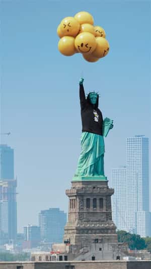 Statue of Liberty Wearing Black Hoodie in a fake-out-of-home ad of Fabletics