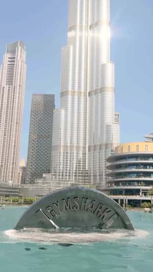 Giant Weight Plate Emerges from Water in a fake-out-of-home ad of CGI Video Gymshark Giant Weight Plate Emerges from Water