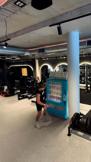 Cans Pop Out of Vending Machine in a fake-out-of-home ad of Hydreau