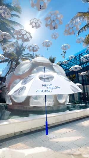 "Eye Dome" Floating Umbrellas in a fake-out-of-home ad of Miami Design District