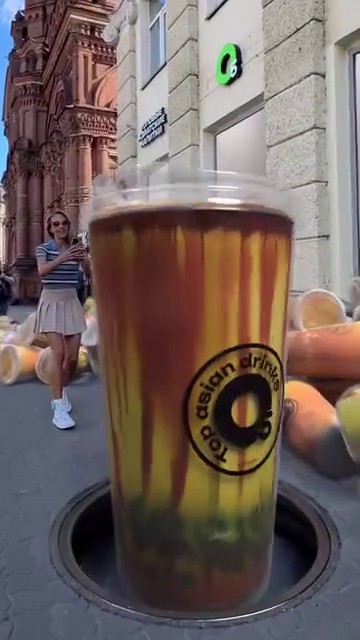 Giant Bubble Tea Cup Rises from Manhole in a fake-out-of-home ad of O5