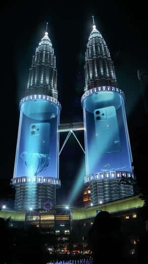 Oppo Phone Emerges from Petronas Twin Towers in a fake-out-of-home ad of KL Foodie