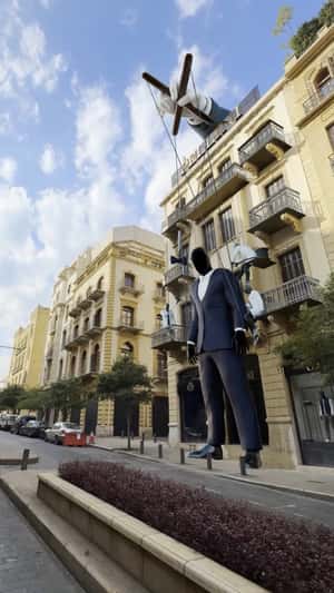 Giant Marionette Wears Suit in a fake-out-of-home ad of Pellini Collection