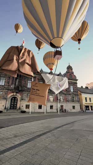 Hotair Balloon Lifts Delivery Package in a fake-out-of-home ad of Plethora 