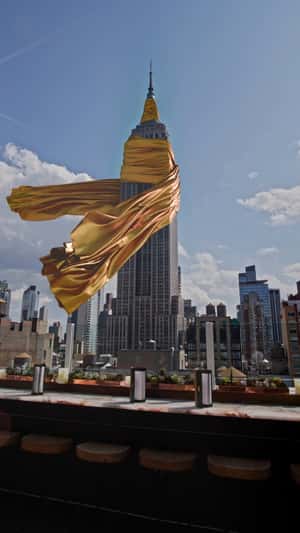 NYC Landmarks Draped in Gold Cloth in a fake-out-of-home ad of Project Runway 