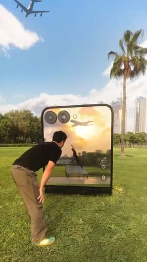 Giant Flip Phone Captures Photo in a fake-out-of-home ad of Samsung