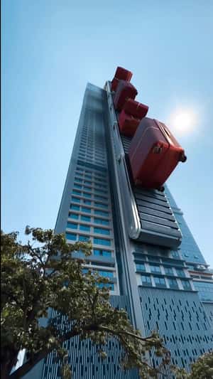 Red Luggage Bags on Conveyor in fake-out-of-home ad of Samsonite