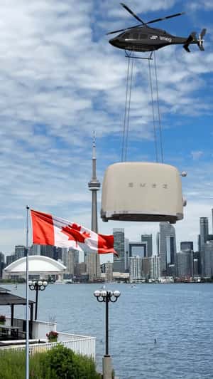 Helicopter Airlifts Massive Toaster in a fake-out-of-home ad of Smeg