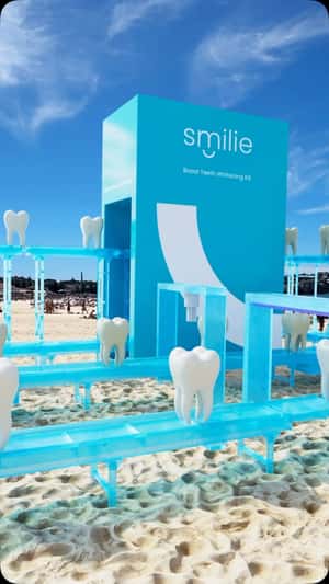 Giant Teeth Whitening Installation on Beach in a fake-out-of-home ad of Smilie