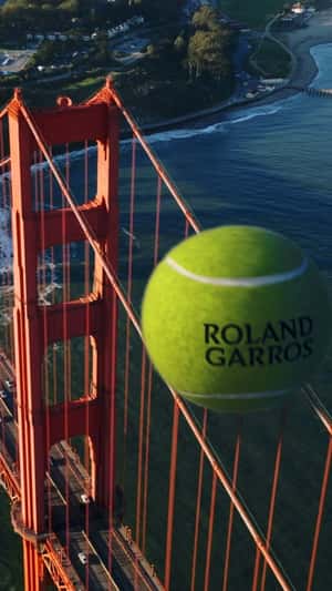 Roland Garros Giant Tennis Ball Across Landmarks in a fake-out-of-home ad of WBD