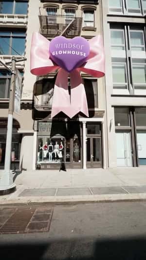 Giant Satin Bow Attaches to Building in a fake-out-of-home ad of Windsor Store 