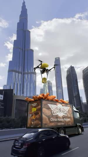 Giant Wings Seasoned on Truck in a fake-out-of-home ad of Wingstop 