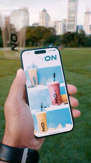 Giant Smoothie in Park in a fake-out-of-home ad of Yon Health 