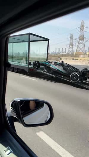 Race Car Slides Off Car Carrier in a fake-out-of-home ad of Adidas