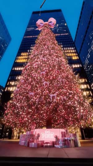 Giant Bow Tops Christmas Tree in a fake-out-of-home ad of Victoria’s Secret PINK