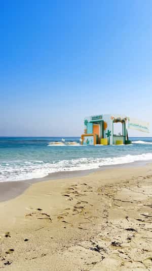 Inflatable Kiosk Floats on Beach in a fake-out-of-home ad of NBE