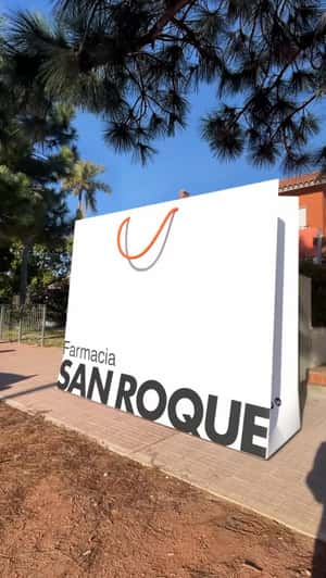 Farmacia San Roque Giant Shopping Bags Glide Through Street