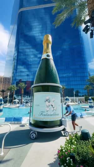 Giant Bottle at Poolside in a fake-out-of-home ad of Fontainebleau Las Vegas 