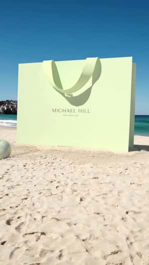 Giant Shopping Bag Covered in Sand in a fake-out-of-home ad of Michael Hill 