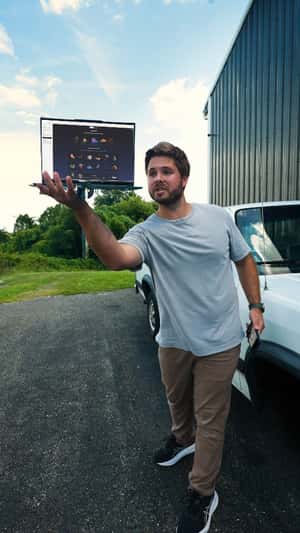 Tire Pops Out of Laptop in a fake-out-of-home ad of Microsoft Copilot 