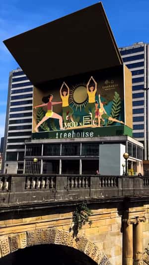 Yoga Scene Pop-Up in Giant Box in a fake-out-of-home ad of Modernist Daily 