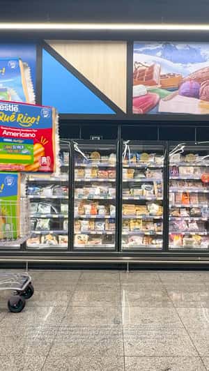 Giant Packages on Cart in a fake-out-of-home ad of Nestlé ¡Qué Rico! 