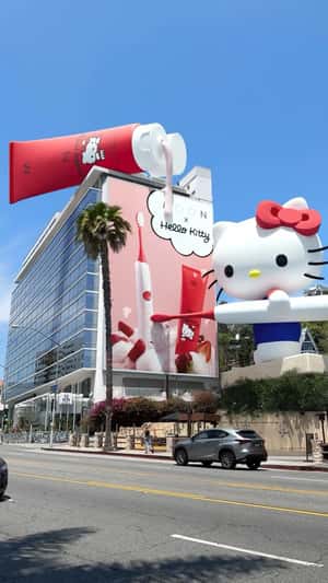 Hello Kitty Holding Brush in fake-out-of-home ad of MOON