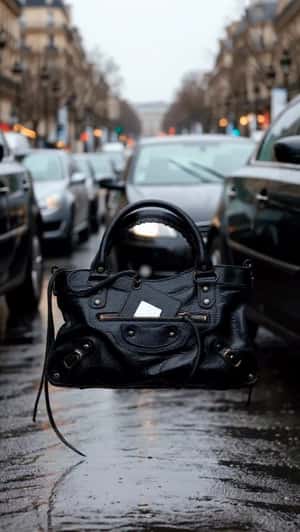 Handbag Floats Through Traffic in a fake-out-of-home ad of Balenciaga 