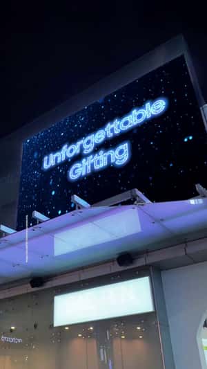 Giant Devices Emerge from Gift Box in a fake-out-of-home ad of Samsung