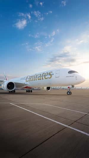 Giant Letters Attach to Plane in a fake-out-of-home ad of Emirates 