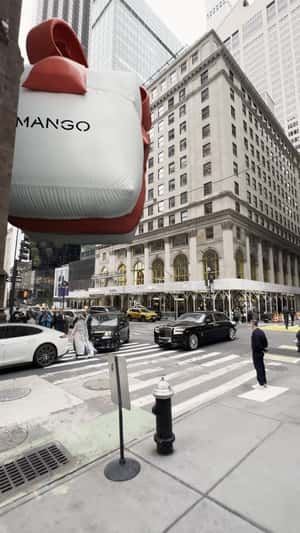 Giant Inflatable Gift Floats Through City in a fake-out-of-home ad of MANGO 