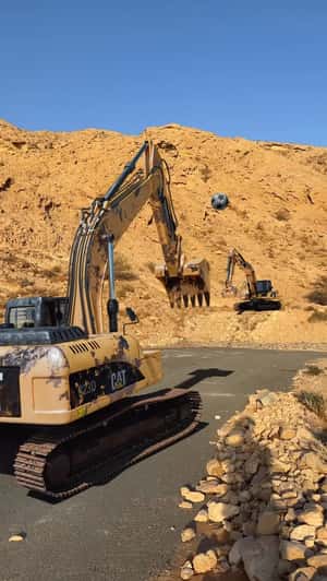 Excavators Play Football in a fake-out-of-home ad of Automax 