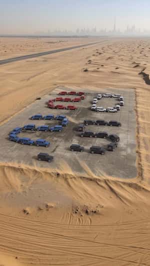 Jeep Wranglers Form "2026" in a fake-out-of-home ad of Automax 